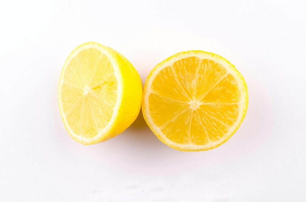 Tea for a sore throat. A lemon cut in half.