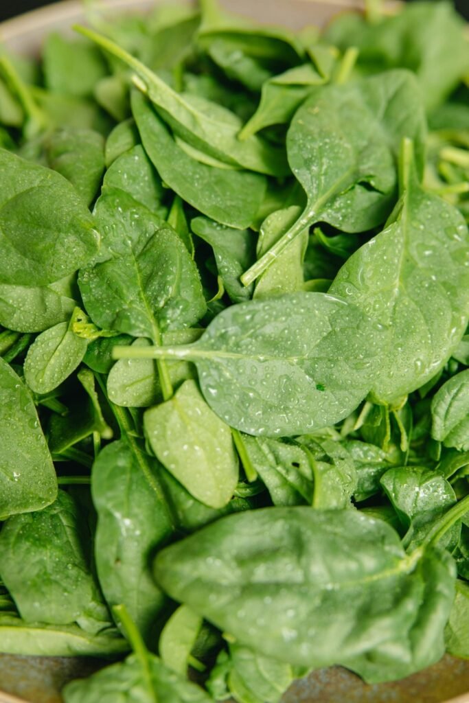 You can easily grow spinach like these fresh, green leaves in your garden.